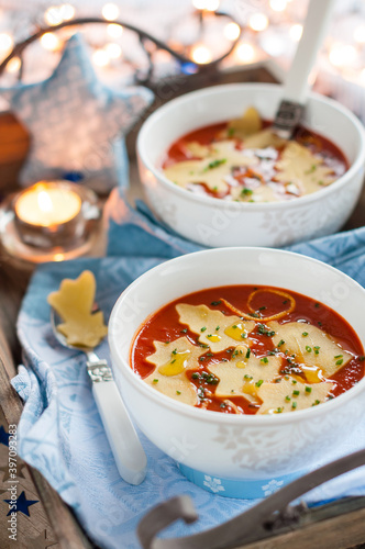 Christmas Tomato Soup with Ornament Shaped Pasta. Winter Decoration.
