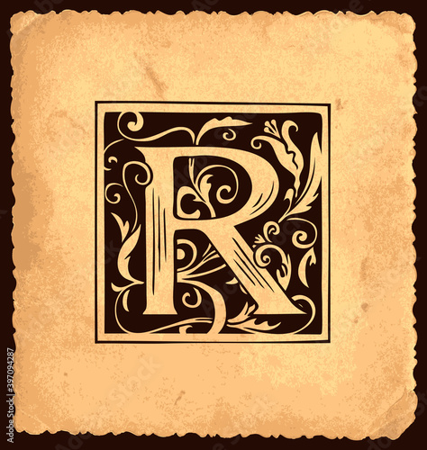 Black initial letter R with Baroque decorations on an old paper background in vintage style. Beautiful filigree capital letter R suitable for monogram, invitation, greeting card, emblem, logo