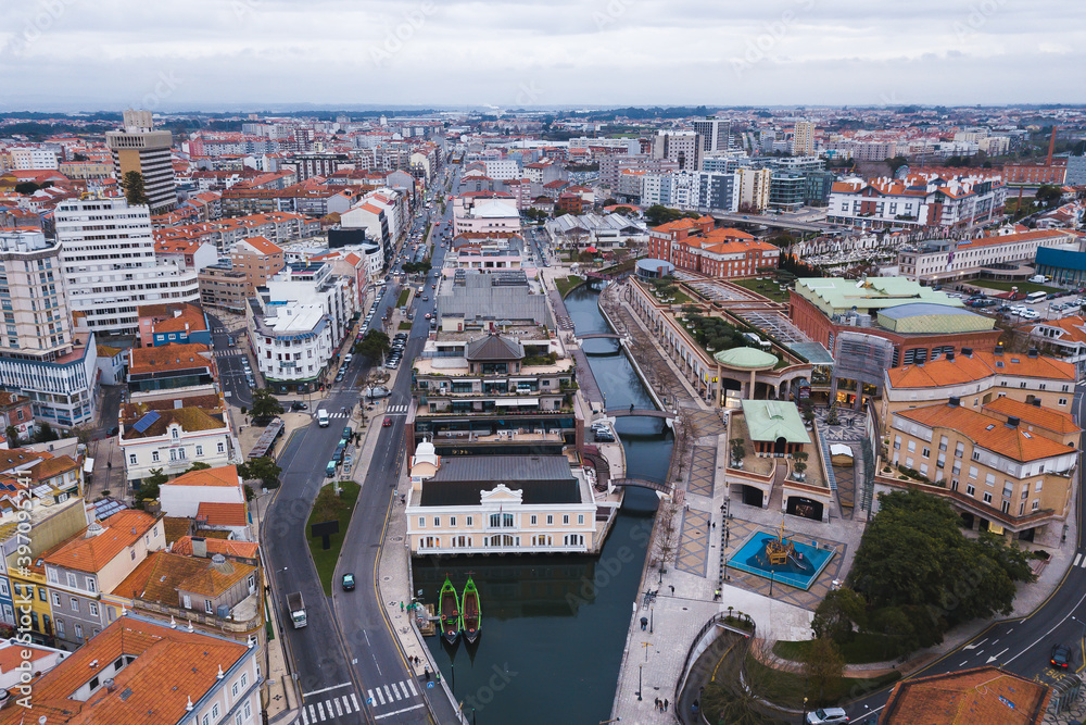 drone shot aerial view from above look Aveiro Portugal cloudy day city center rooftops orange red canal