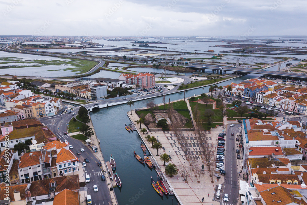Obraz premium drone shot aerial view from above look Aveiro Portugal cloudy day city center rooftops orange red canal streets boats
