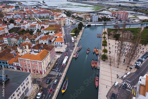 drone shot aerial view from above look Aveiro Portugal cloudy day city center rooftops orange red canal streets boats 