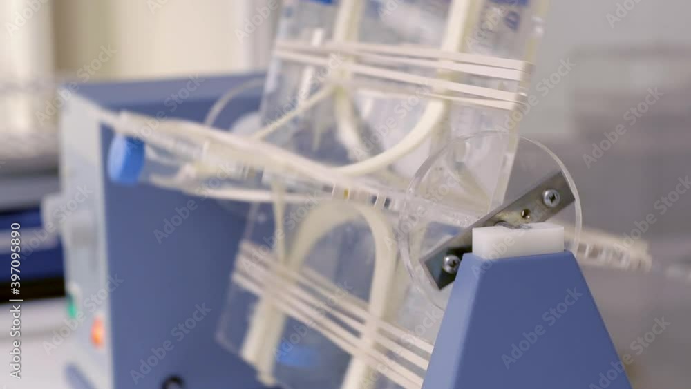 Close up of machine rotating test tubes Close up of machine rotating test tubes