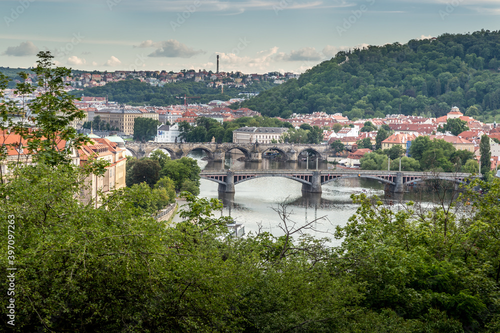 Panoramic view of picturesque Prague city on sunset. River Vltava and Prague bridges. Prague, Czech Republic