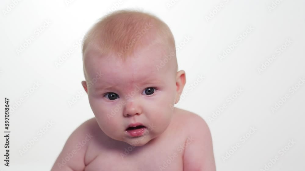 Shirtless curious baby girl looking around Shirtless curious baby girl looking around