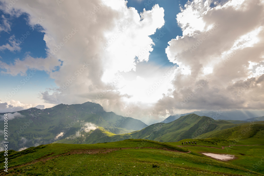 Beautiful mountain landscape at Caucasus mountains with clouds and cloudy sky.