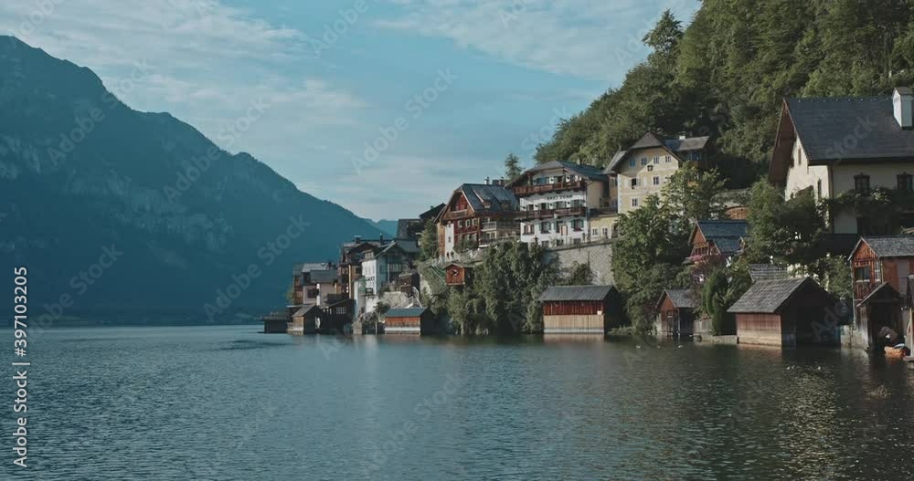 Breathtaking view of stunning beautiful nature and vallage on coastline. Inspiring landscape of high mountains with trees, clear blue water on magnifficent sunny day. Concept of freedom, travel. Breathtaking view of stunning beautiful nature and vallage on coastline. Inspiring landscape of high mountains with trees, clear blue water on magnifficent sunny day. Concept of freedom, travel.