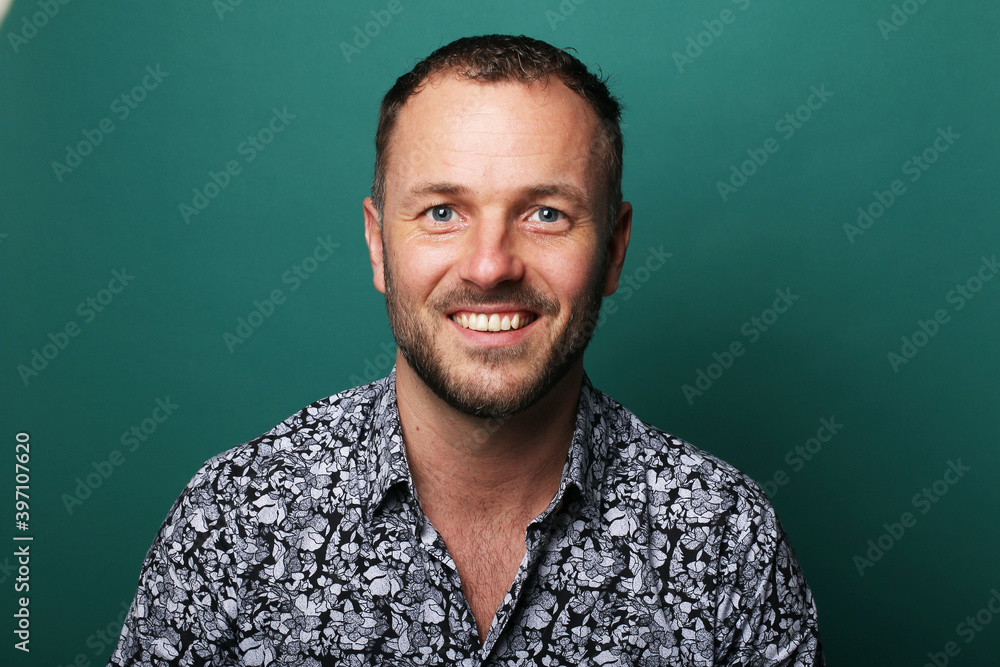 Portrait of a man in front of a colored background Portrait of a man in front of a colored background