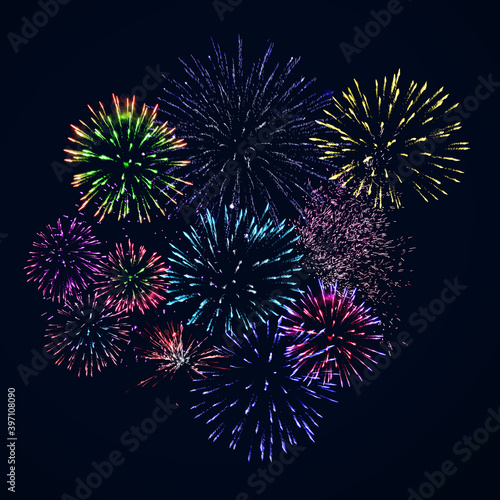 Colorful fireworks of various colors over night sky. Celebration and anniversary concept.