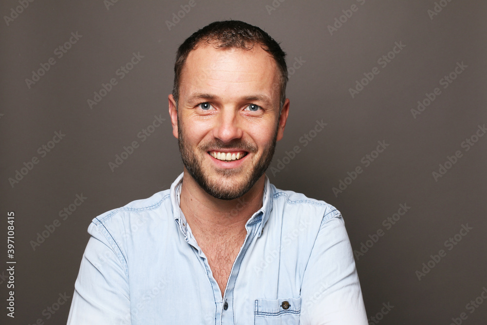 Portrait of a man in front of a colored background Portrait of a man in front of a colored background