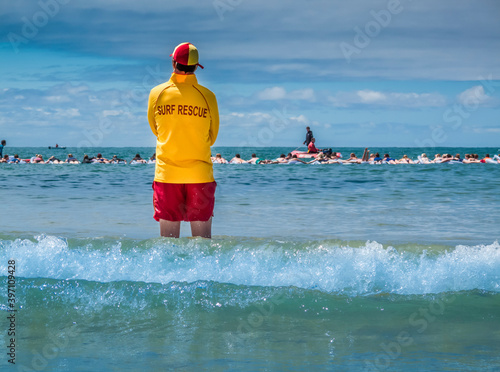 Surf lifesaver watching for danger at a beach in Australia