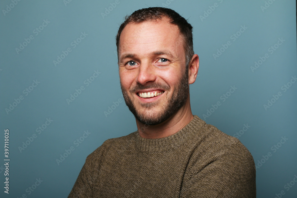 Portrait of a man in front of a colored background Portrait of a man in front of a colored background