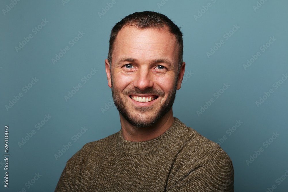 Portrait of a man in front of a colored background Portrait of a man in front of a colored background