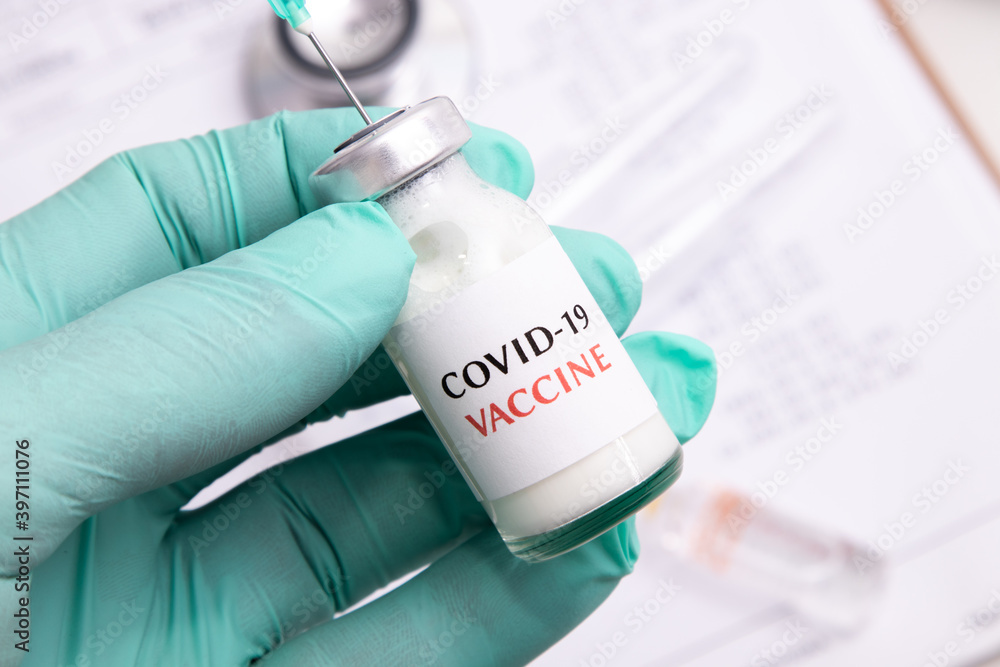 hand with vial of coronavirus vaccine hand with vial of coronavirus vaccine
