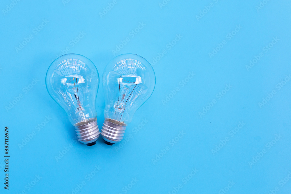 Light bulbs on blue background. Ideas and creative thinking concept. Top view Light bulbs on blue background. Ideas and creative thinking concept. Top view