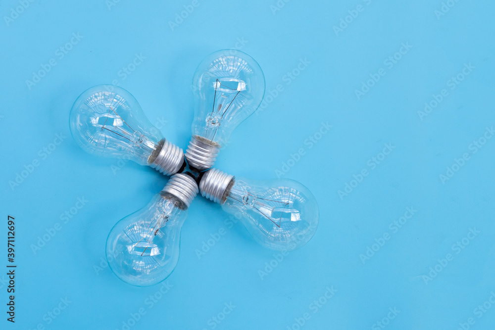 Light bulbs on blue background. Ideas and creative thinking concept. Top view Light bulbs on blue background. Ideas and creative thinking concept. Top view