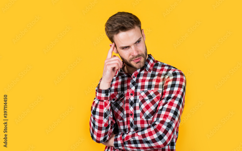 he got great style. facial hair and skin care. man wear checkered shirt. unshaven guy in casual style. male hairdresser and barbershop. male beauty trend. bearded man with sexy bristle. copy space