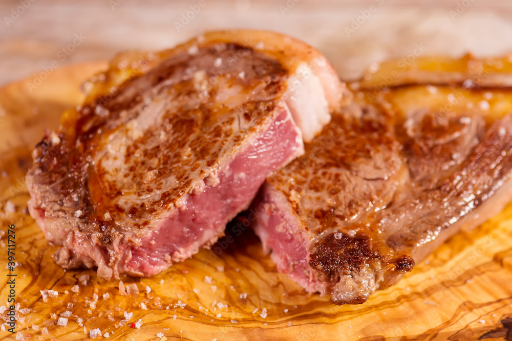 veal chop cooked on the grill with natural olive wood veal chop cooked on the grill with natural olive wood