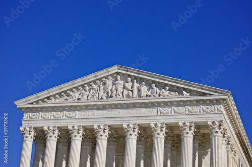 West pediment of the exterior of the US Supreme Court building in Washington, DC with Copy Space of sky above