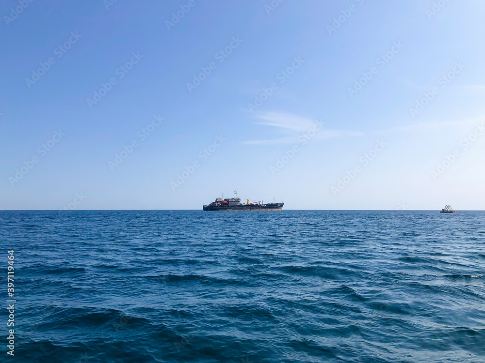 The ship on horizon in Black sea. Crimea