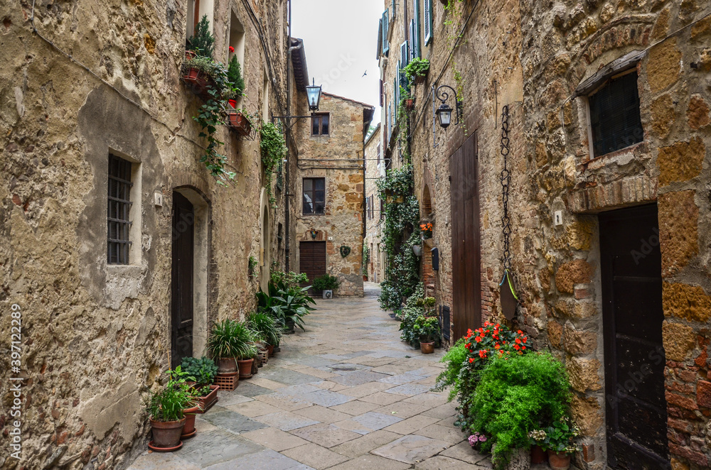 Beautiful view of old traditional houses and idyllic alleyway in the historic town. Italy