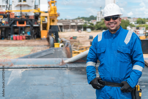 Portrait of a worker in front of a port