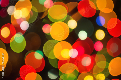 Christmas background-garlands with colorful lights on a decorated Christmas tree, bokeh