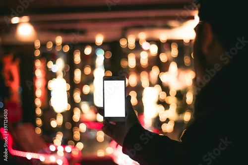 Horizontal man holding smartphone in a hand ad. Special offer with blank wire isolated display for inserting text or design photo