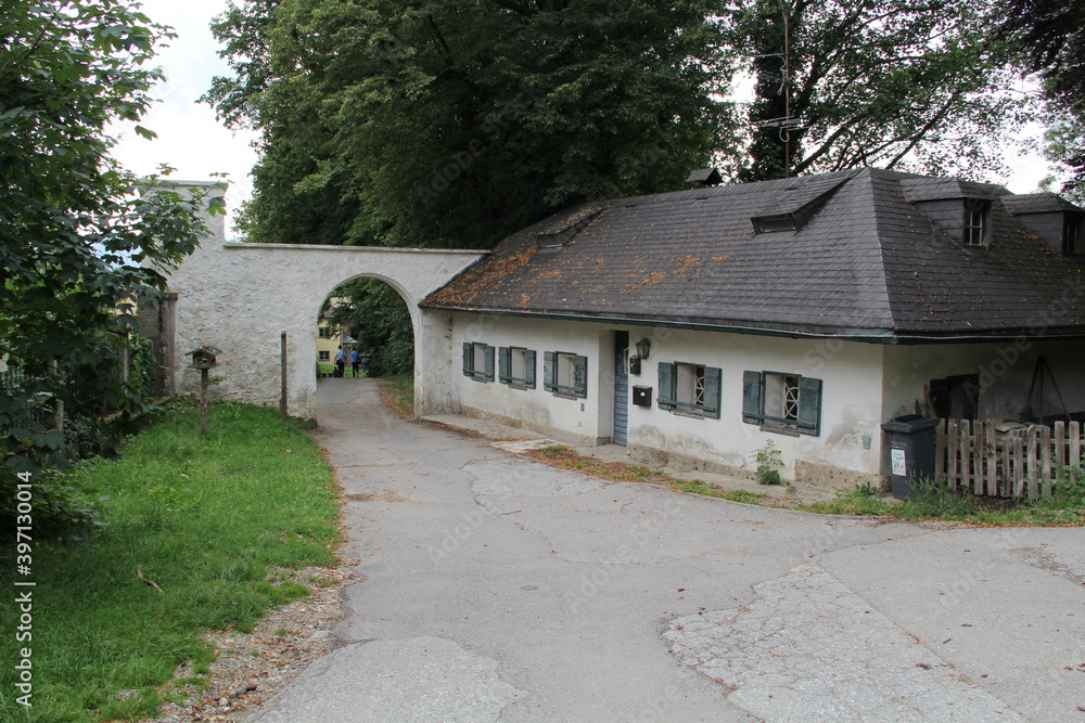 low ancient house with an arch at the entrance low ancient house with an arch at the entrance