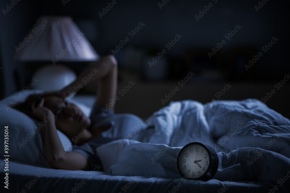 Depressed young woman lying in bed cannot sleep from insomnia - obrazy, fototapety, plakaty 
