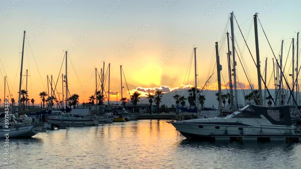 Small marina with boats at sunset. Small marina with boats at sunset.