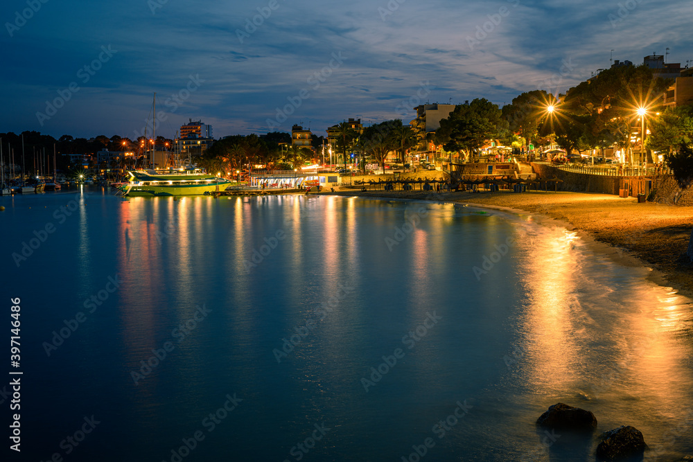 A long exposure image of Porto Cristo port and city beach on Mallorca island in Spain 