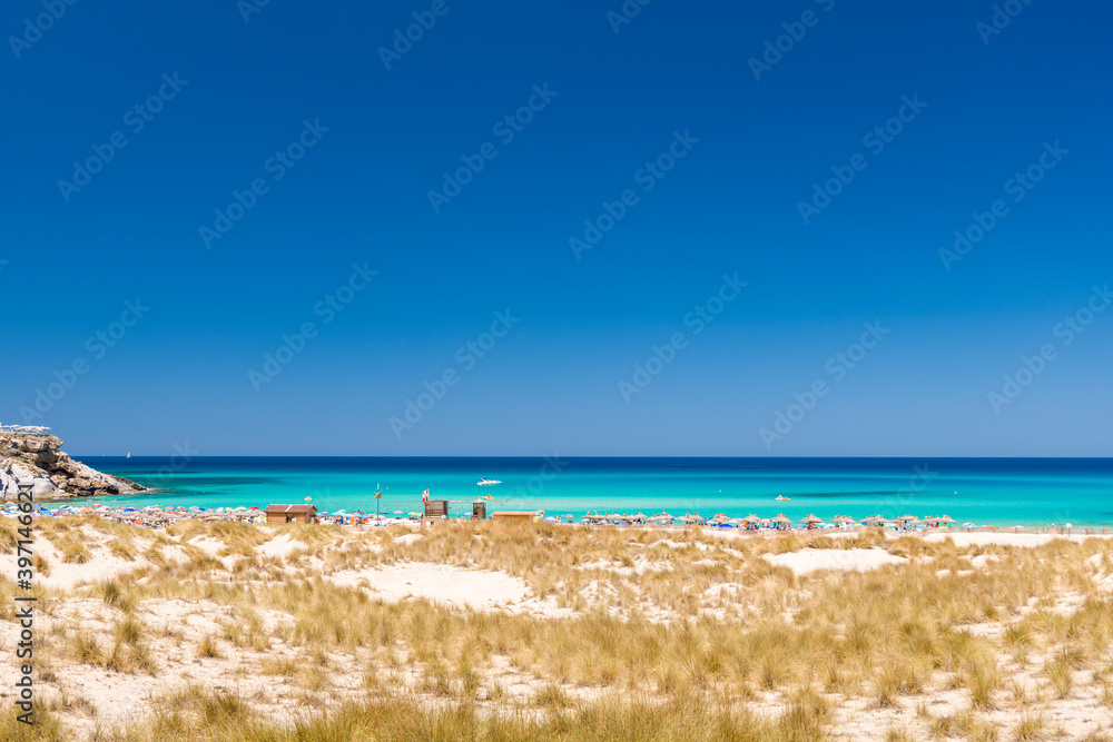 A view on the Cala Mesquida beach from the nearby hiking path on Mallorca island in the Mediterranean Sea A view on the Cala Mesquida beach from the nearby hiking path on Mallorca island in the Mediterranean Sea