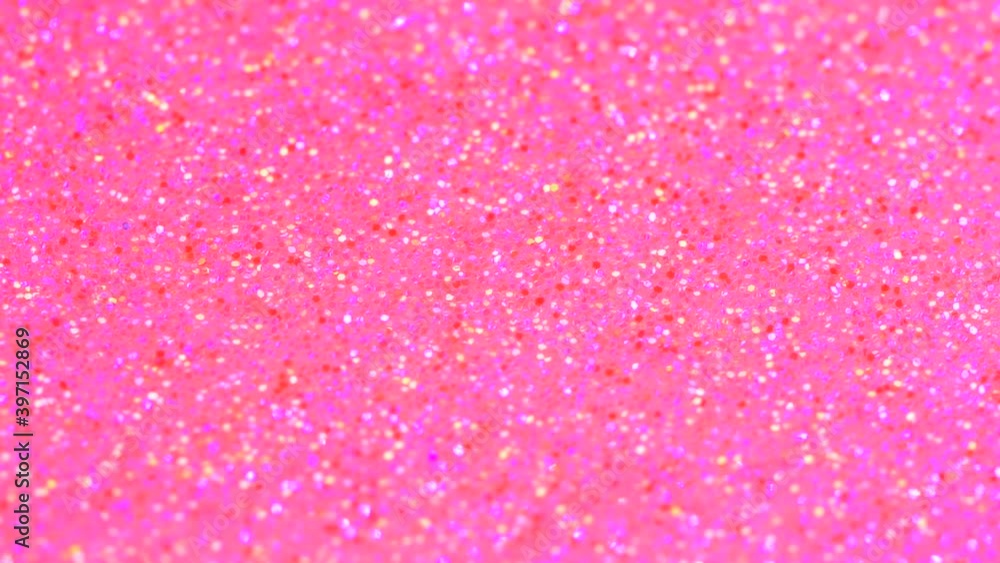 Water drop falling into beautiful pink rose neon glitter surface and splashing Water drop falling into beautiful pink rose neon glitter surface and splashing