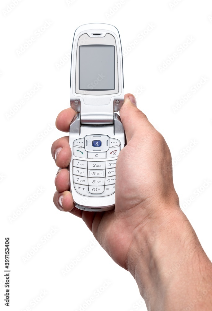 Holding a flip phone style cell phone Holding a flip phone style cell phone