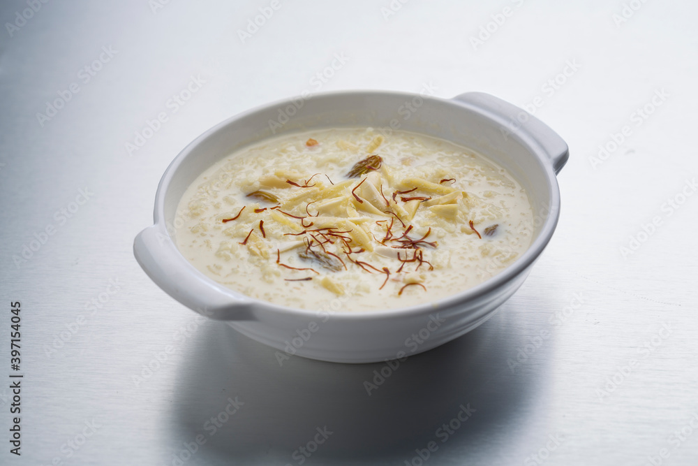 kheer or rice pudding is an Indian dessert in a bowl with dry fruits toppings kheer or rice pudding is an Indian dessert in a bowl with dry fruits toppings