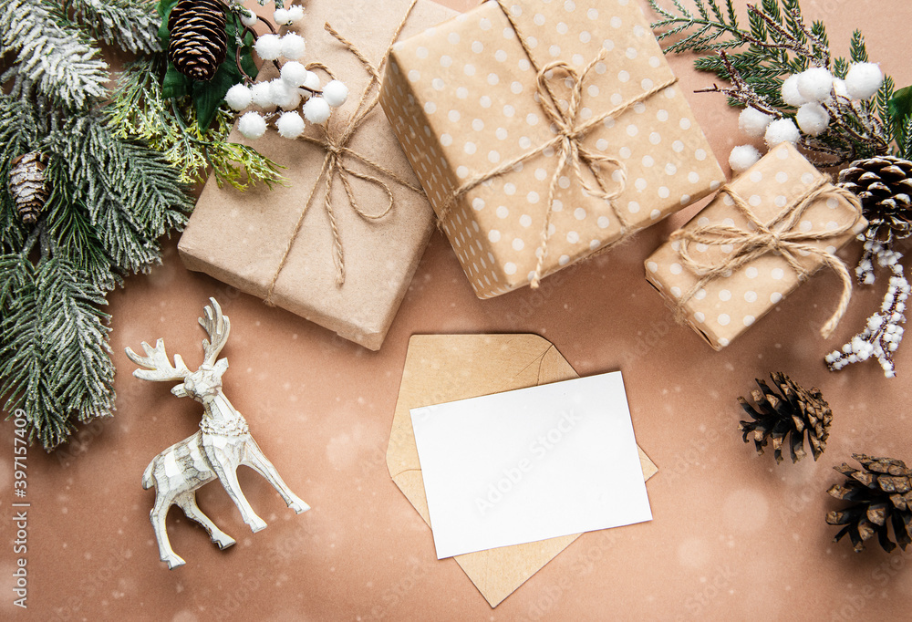 Christmas composition with card, deer, gift boxes and fir branches. Christmas composition with card, deer, gift boxes and fir branches.