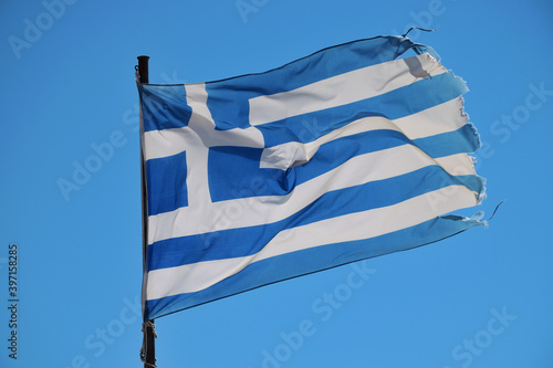 Greek flag on the blue sky