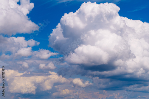 Picturesque heavy fluffy summer clouds. Blue marvelous sky view background. Stock photo. © Olga