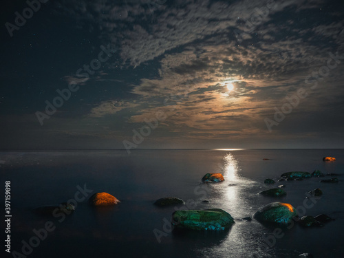 Moon light and light road on the water of Ladoga lake