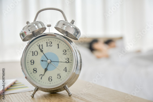 Clock time wake up on table in bedroom