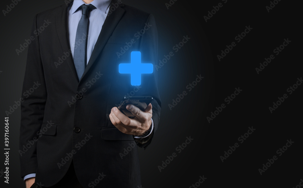 Businessman, man hold in hand offer positive thing such as profit, benefits, development, CSR represented by plus sign.The hand shows the plus sign Businessman, man hold in hand offer positive thing such as profit, benefits, development, CSR represented by plus sign.The hand shows the plus sign