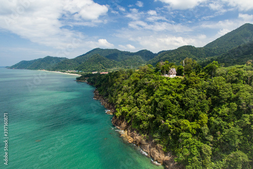 Aerial view of tropical coastline on Koh Chang, Thailand with temple, mountains,jungle and ocean