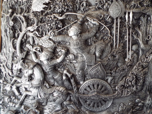 Chiang Mai, Thailand, December 6, 2018: Detail of a tin and silver relief inside the Wat Muen San temple, Chiang Mai silver temple photo