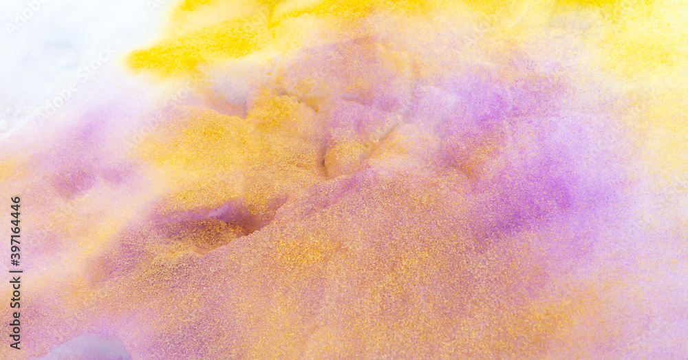 Yellow and purple paint on the snow in winter.