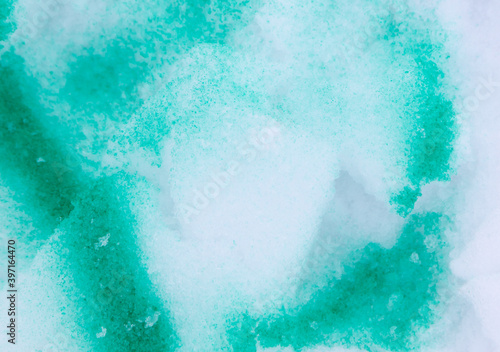Fototapeta Naklejka Na Ścianę i Meble -  Green paint on the snow in winter.