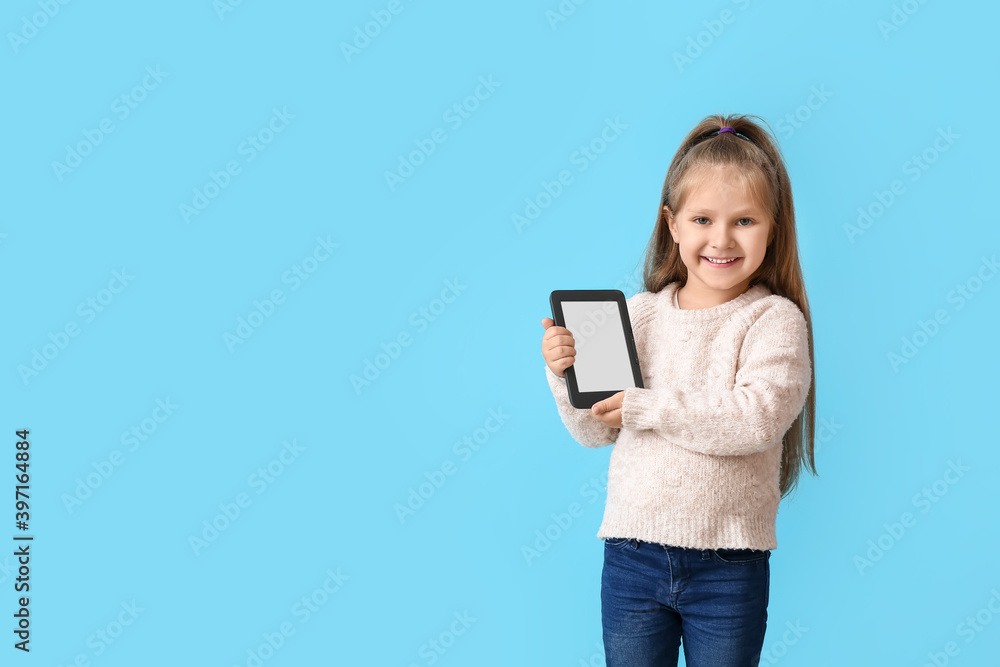 Little girl with e-reader on color background Little girl with e-reader on color background