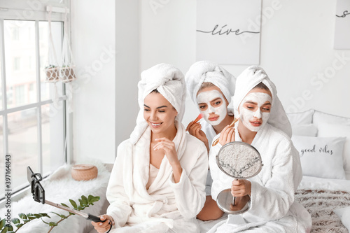 Beautiful young women taking selfie at pamper party