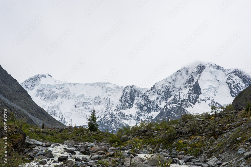 view of the snow-capped Belukha peak from the shore of lake Akkem view of the snow-capped Belukha peak from the shore of lake Akkem