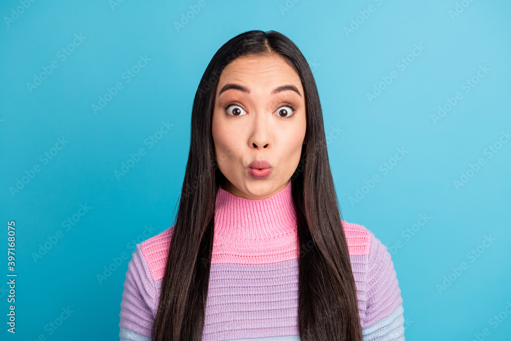 Close-up portrait of pretty amazed girl wearing turtleneck news reaction pout lips isolated over bright blue color background Close-up portrait of pretty amazed girl wearing turtleneck news reaction pout lips isolated over bright blue color background