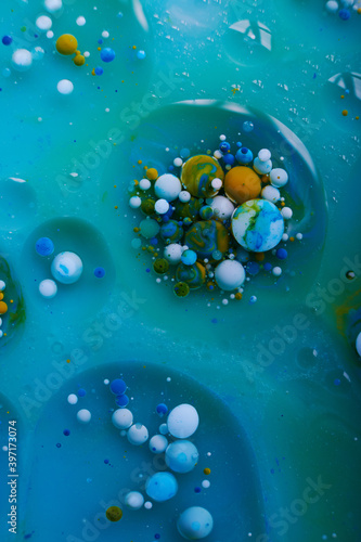 Abstract blurred background with colorful gradient colors. Oil drops in water abstract psychedelic image pattern.